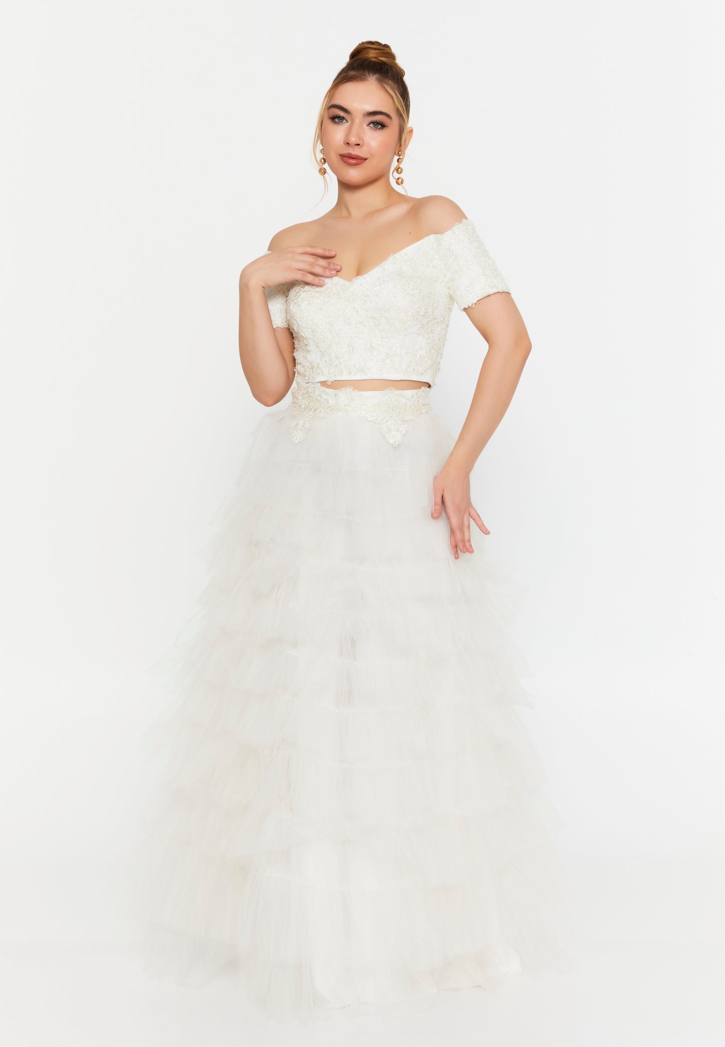 Model wearing white lace crop top and layered tulle maxi skirt set, off-shoulder bridal 2-piece outfit