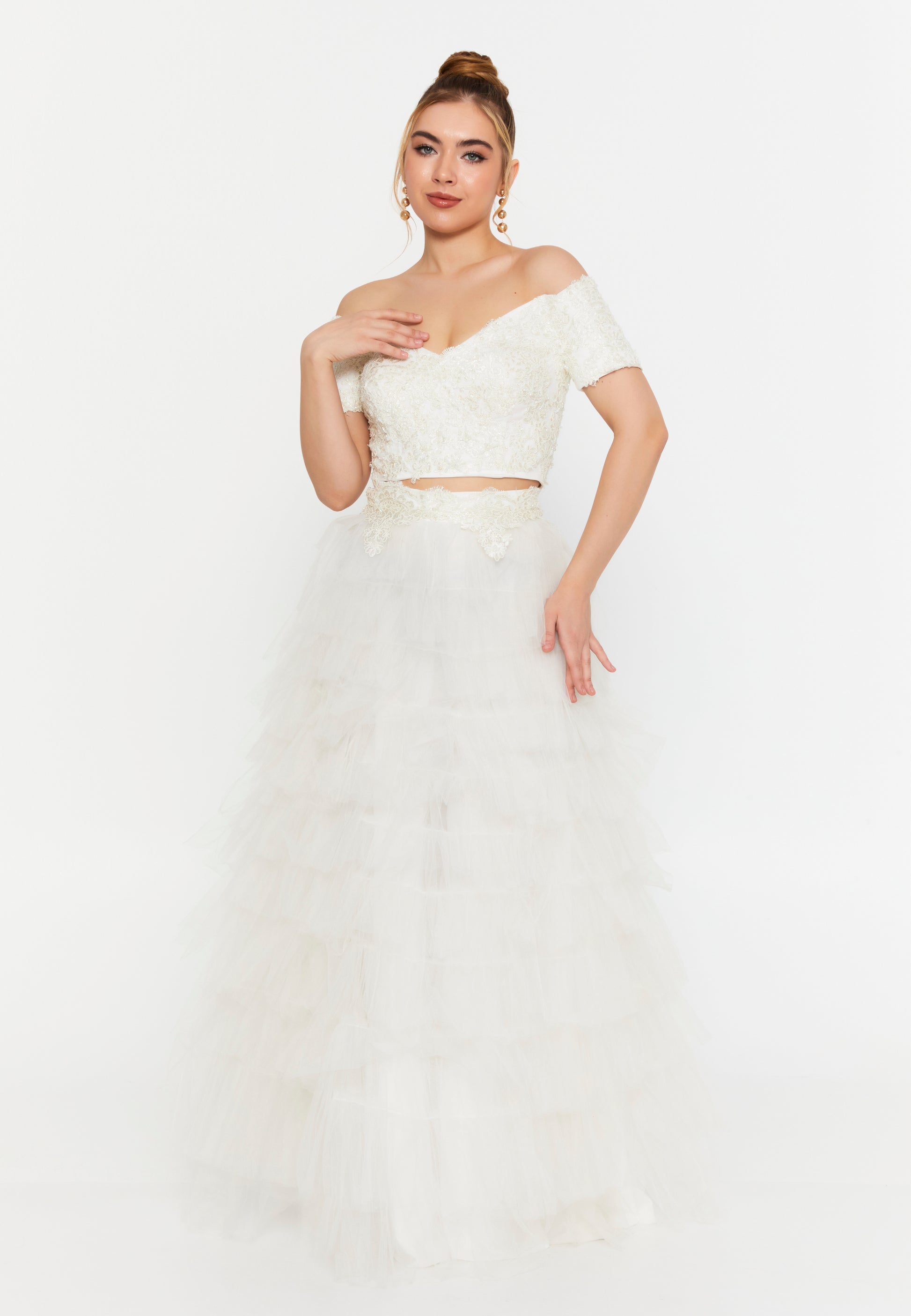 Model wearing white lace crop top and layered tulle maxi skirt set, off-shoulder bridal 2-piece outfit