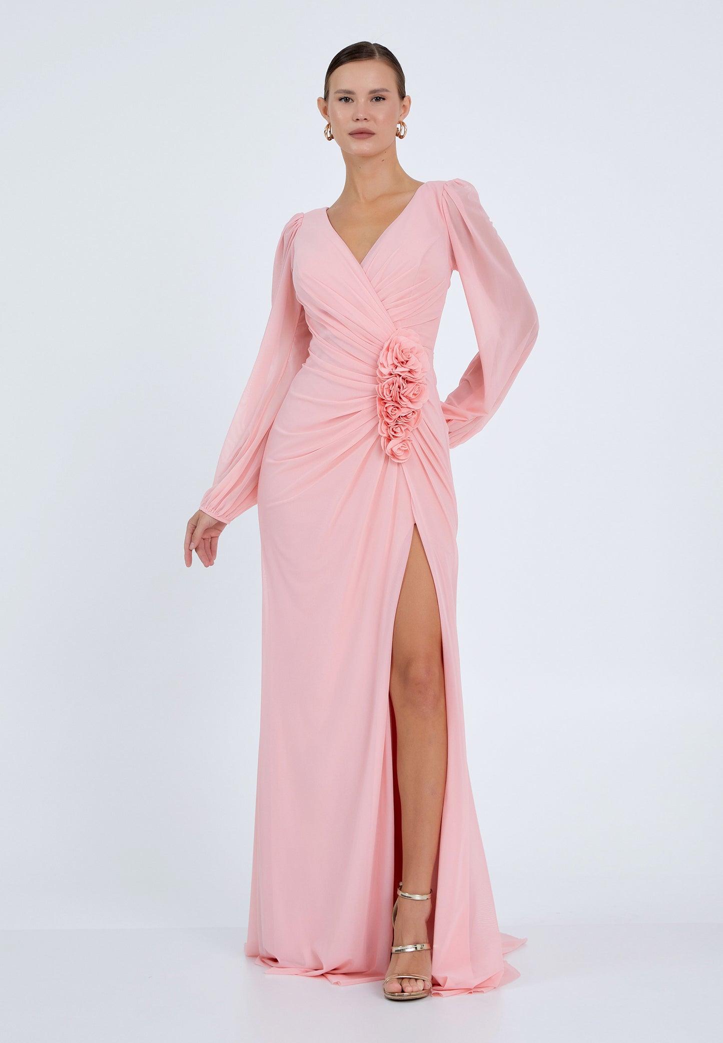 Elegant pink maxi dress with floral detail and slit – front view
