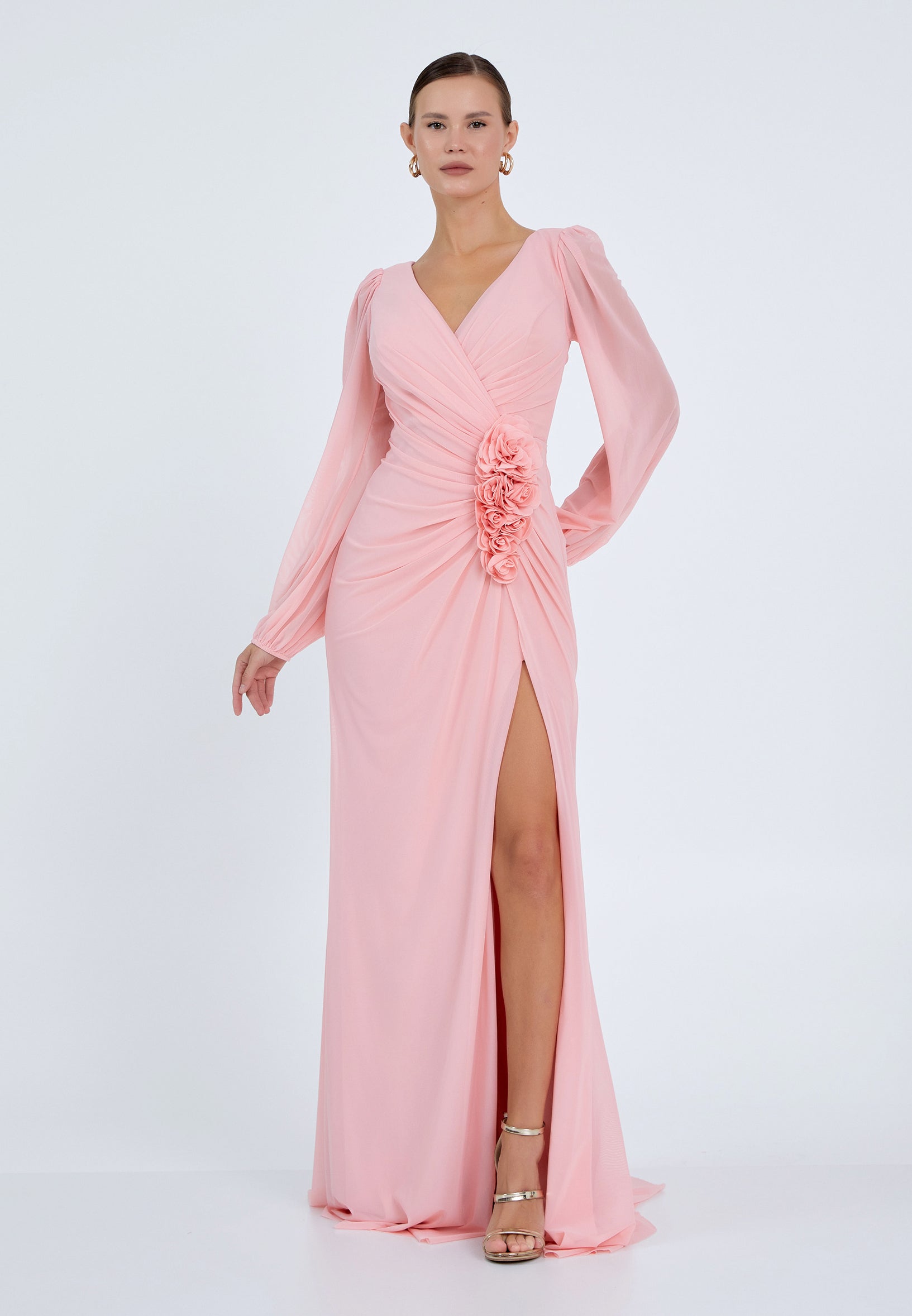 Elegant pink maxi dress with floral detail and slit – front view