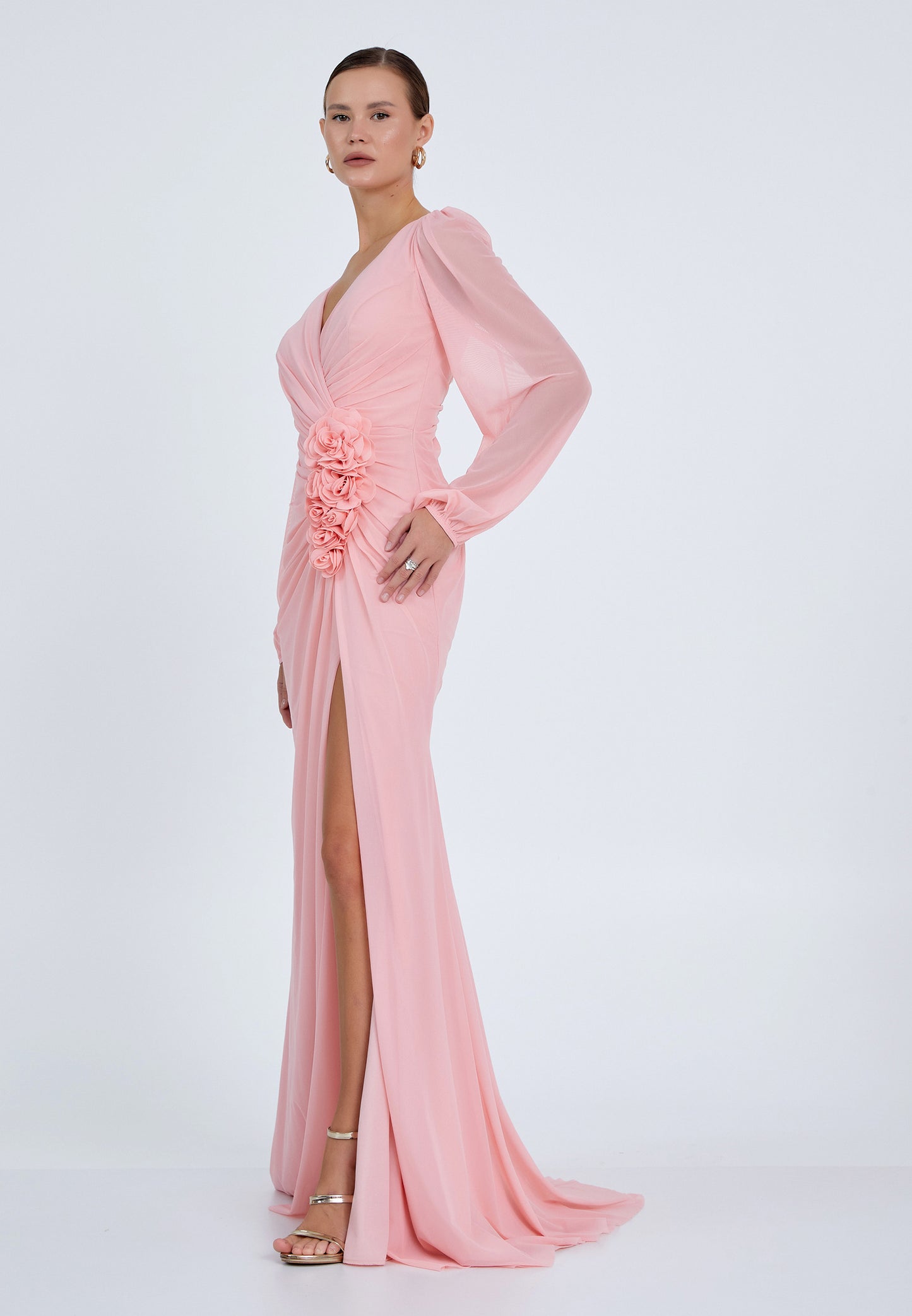 Side profile of pink chiffon formal dress with floral accents