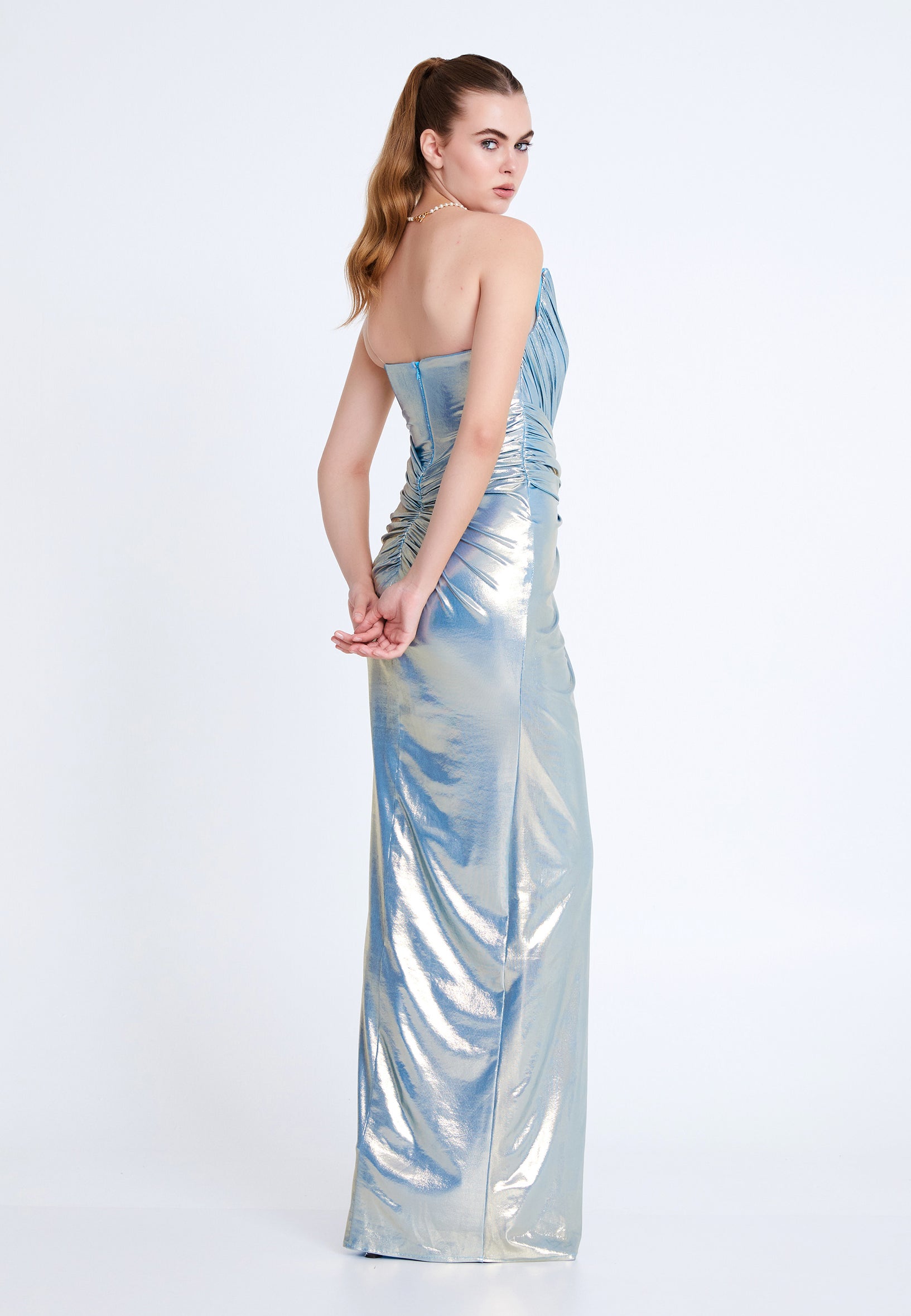Back view of ice blue one-shoulder formal gown with zipper closure