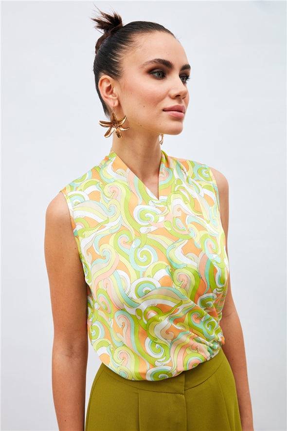 Patterned green blouse with an elastic waistband