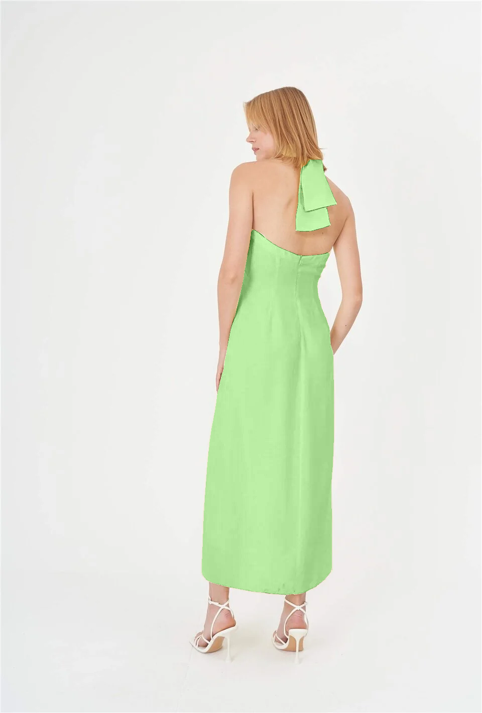 Embrace sustainable fashion with this eco-friendly green summer dress. Crafted from lightweight bio-based and organic fabric, this halter neck dress is ideal for beach outings, pool parties, social gatherings, and hot summer street fashion.